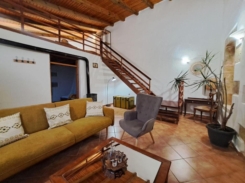a living room with a couch and a chair at Villa Nama in Kissamos