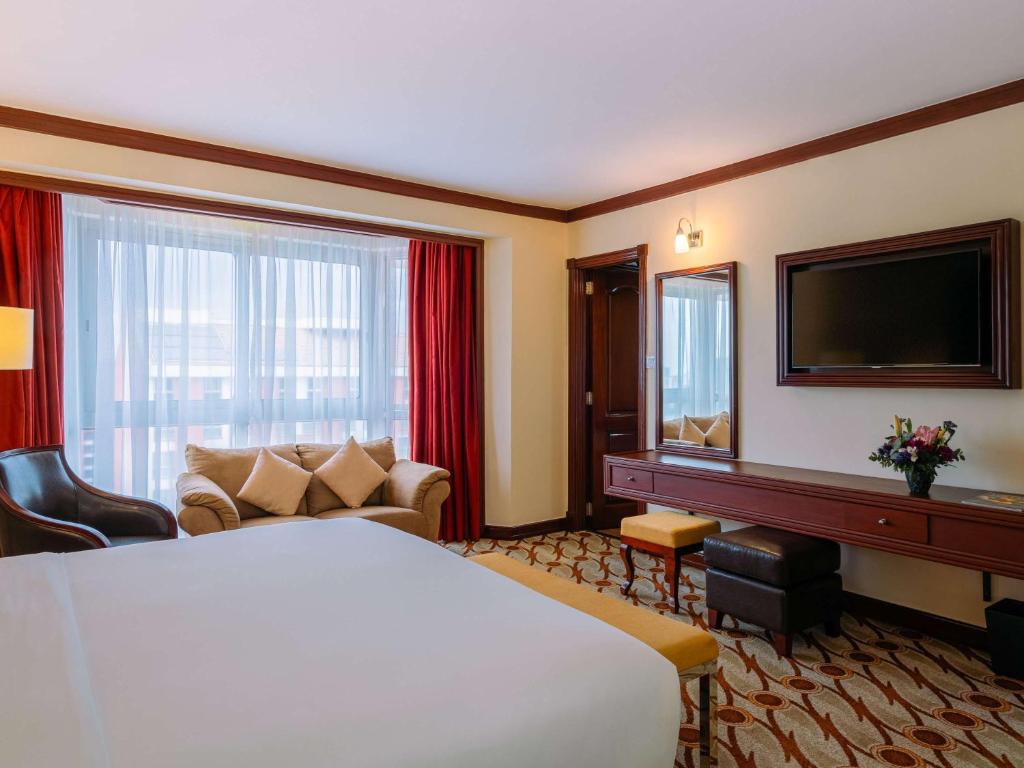Postel nebo postele na pokoji v ubytování Mövenpick Hotel & Residences Nairobi