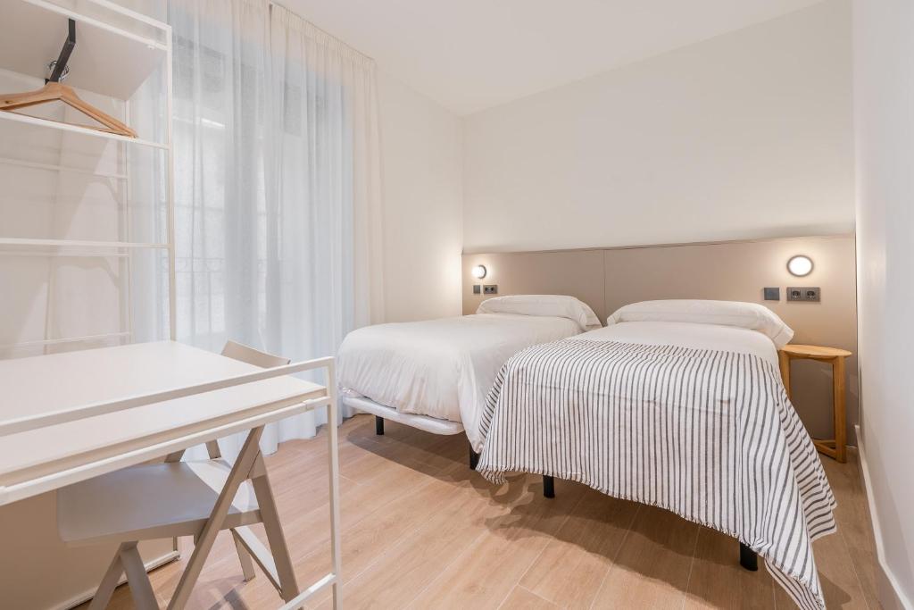 Postel nebo postele na pokoji v ubytování Casa Lambda
