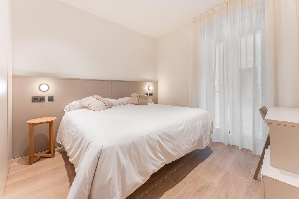 Postel nebo postele na pokoji v ubytování Casa Lambda