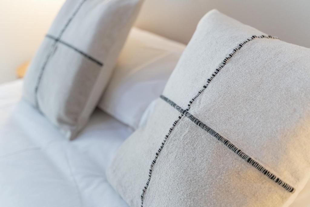 Postel nebo postele na pokoji v ubytování Casa Lambda