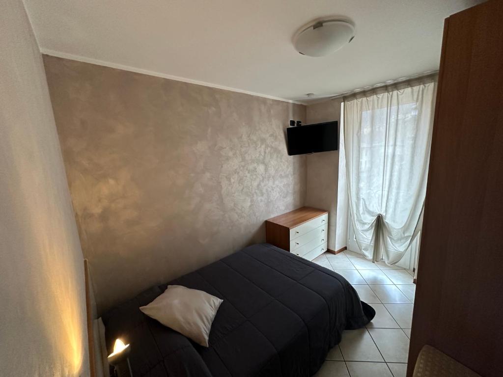 A bed or beds in a room at Hotel Avogadro