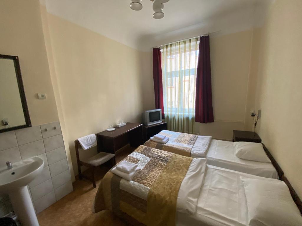 Postel nebo postele na pokoji v ubytování Hostel Viktorija with Private Rooms