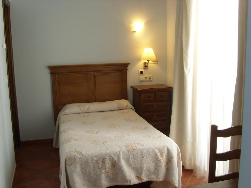 Postel nebo postele na pokoji v ubytování Hotel Plateros