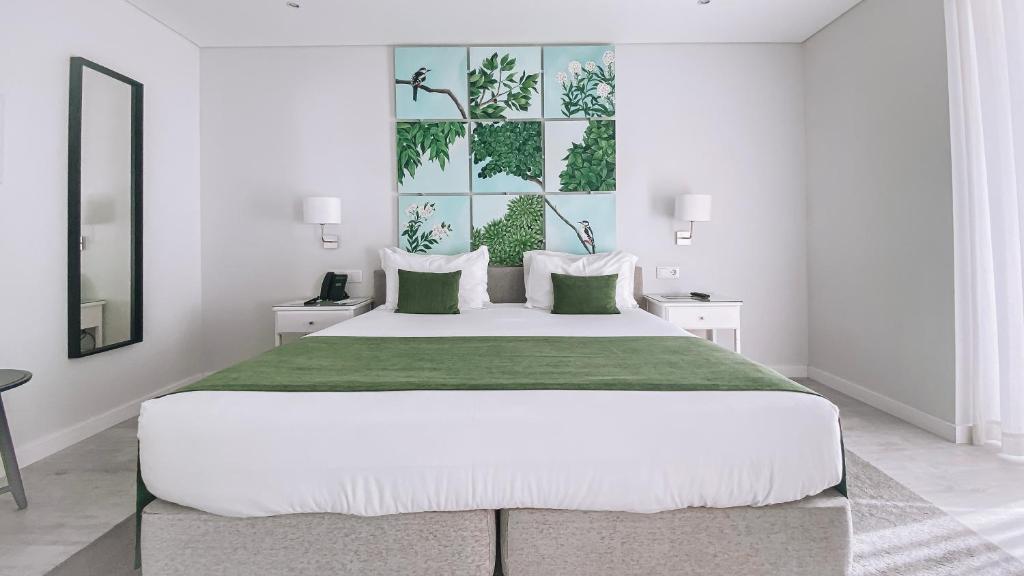 Кровать или кровати в номере Rio Art Hotel