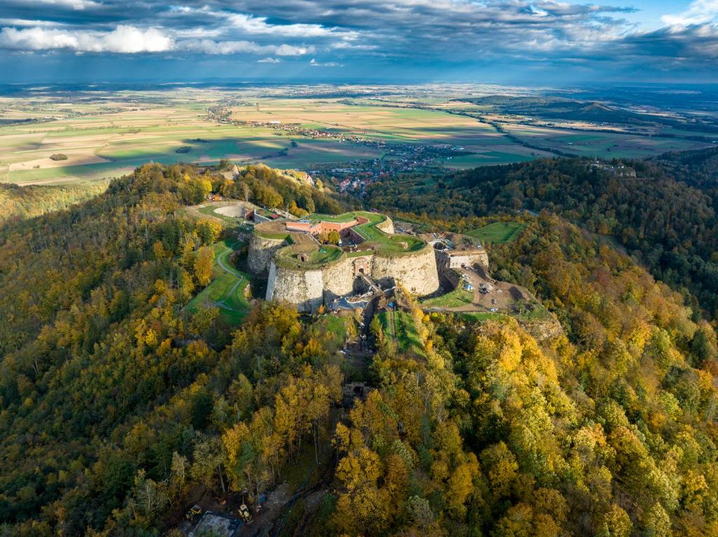 an aerial view of a castle in a forest at Twierdza Srebrna Góra Donżon in Srebrna Góra