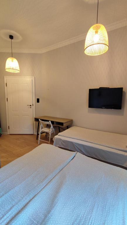Postel nebo postele na pokoji v ubytování Kamienica Ogrodowa Rooms