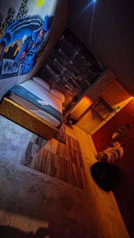 Una cama o camas en una habitación de Urban Hostal San Gil- Piscina Restaurante Bar