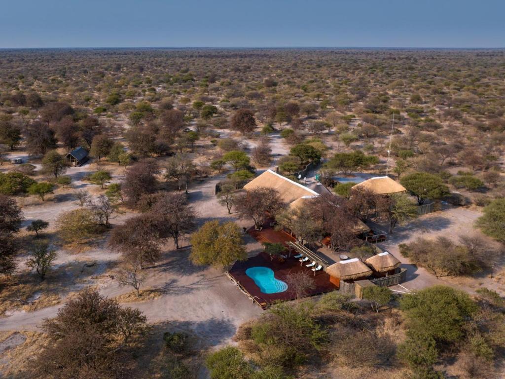 an aerial view of a house in the middle of the desert at Evolve Back Kalahari in Central Kalahari