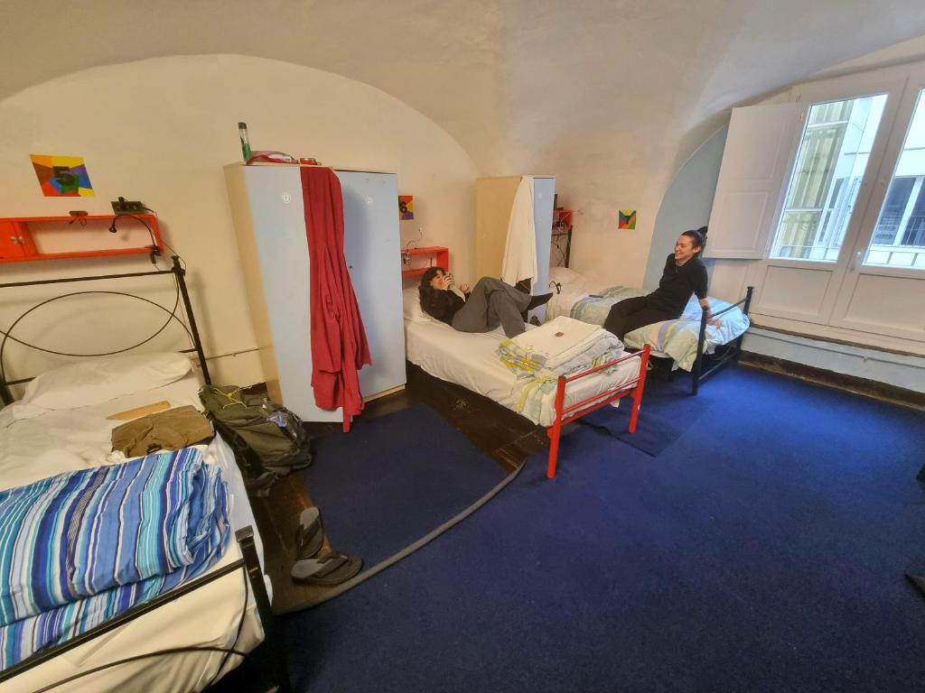 Postel nebo postele na pokoji v ubytování Hostel Il Nosadillo - Bologna