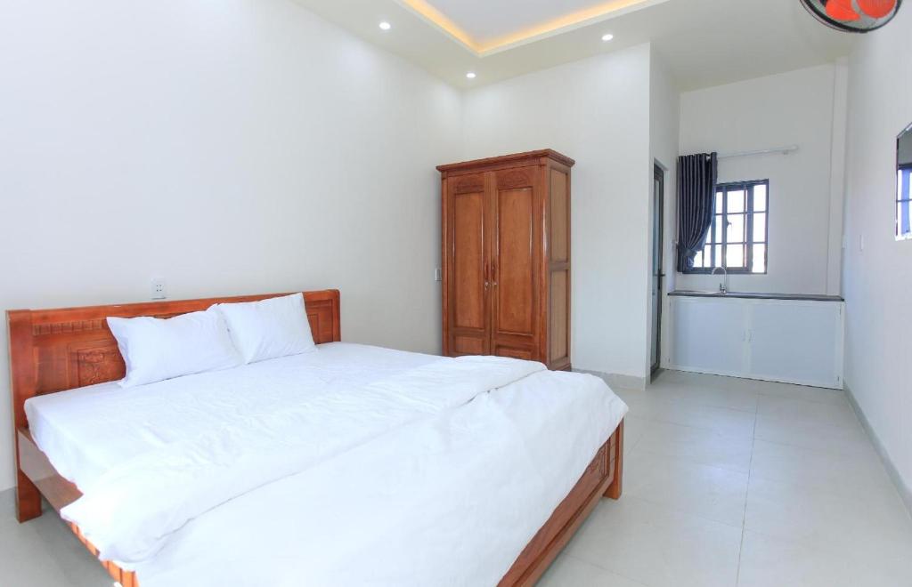 Krevet ili kreveti u jedinici u objektu OYO 1064 Phat Tai Hotel And Apartment