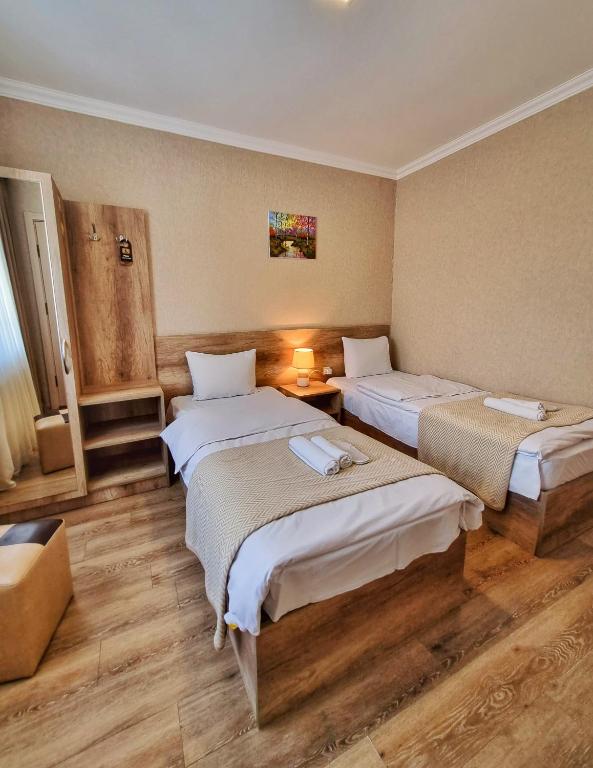 Voodi või voodid majutusasutuse Sunshine Kazbegi toas