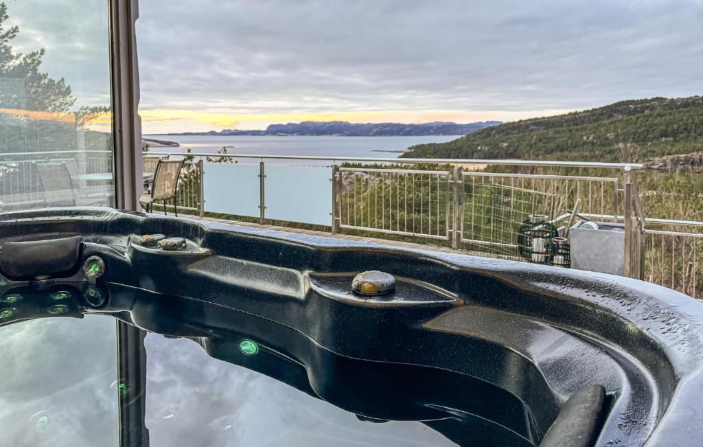 a bath tub with a view of the water at Awesome Home In Fevg With Wi-fi in Fevåg