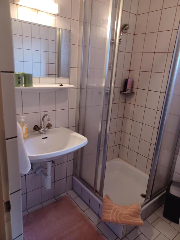 a bathroom with a sink and a shower at Lampererhof in Sankt Johann in Tirol