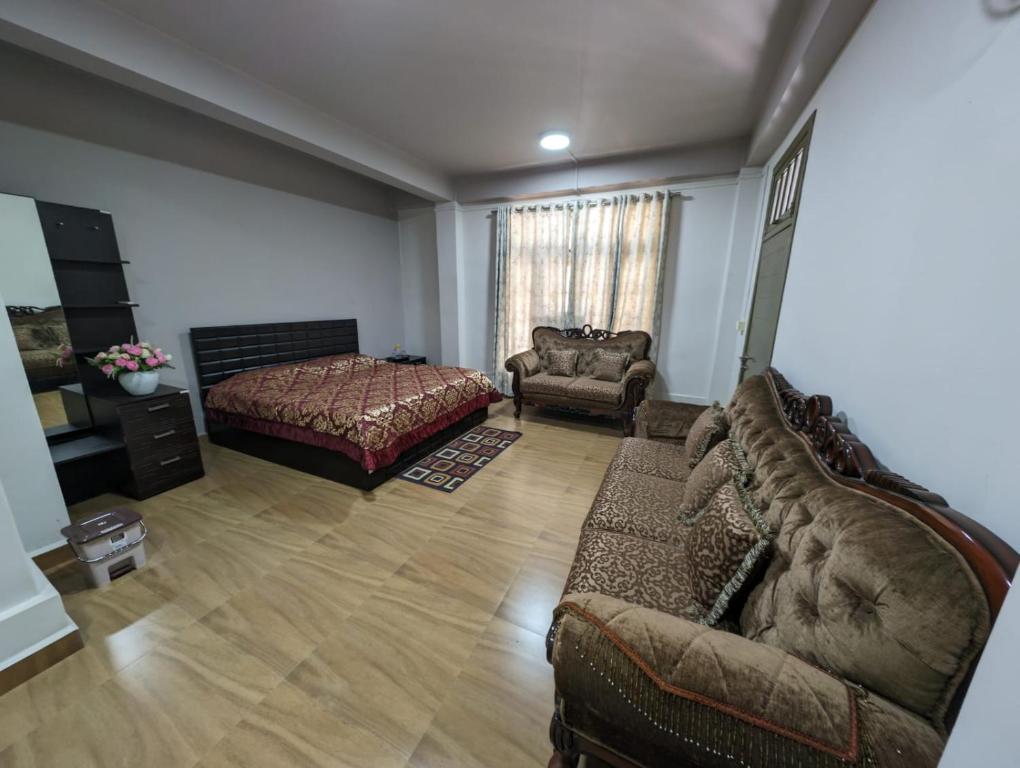 Een bed of bedden in een kamer bij RT Mutbu