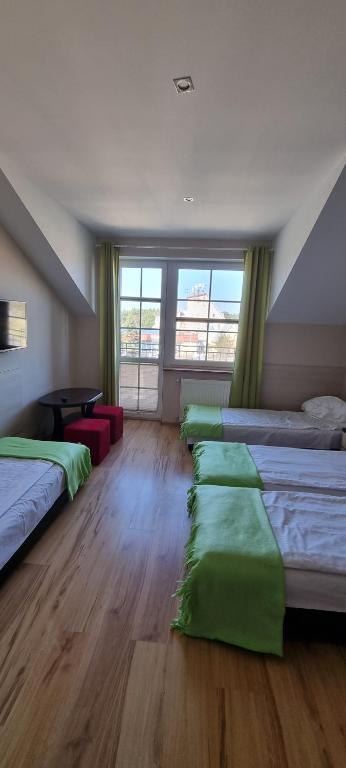 Postel nebo postele na pokoji v ubytování Pokoje w Zielonym Domku