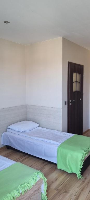 Postel nebo postele na pokoji v ubytování Pokoje w Zielonym Domku