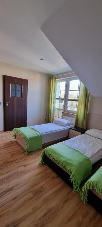 Postel nebo postele na pokoji v ubytování Pokoje w Zielonym Domku