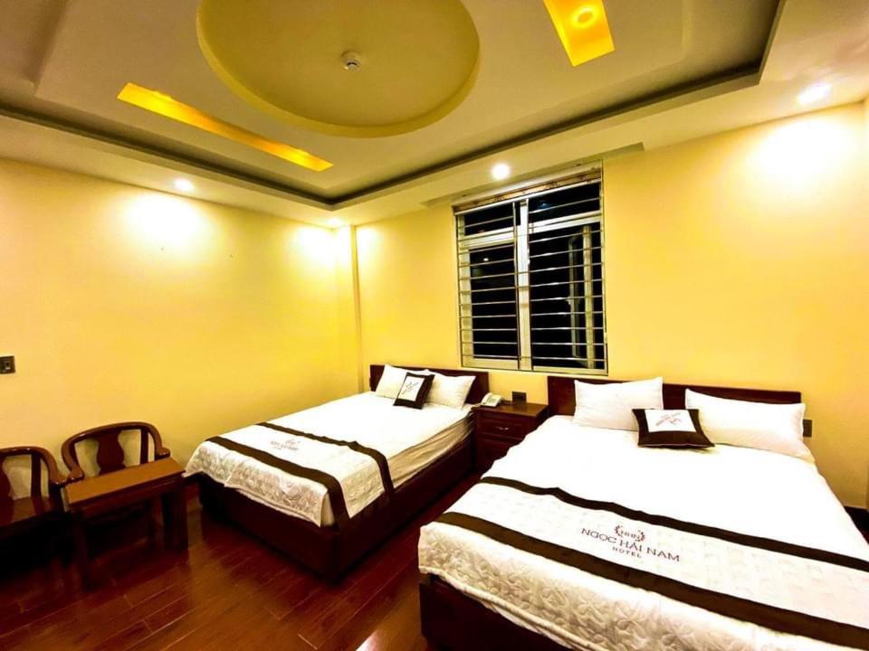 Kama o mga kama sa kuwarto sa Ngọc Hải Nam Hotel - Khách Sạn Nhơn Trạch