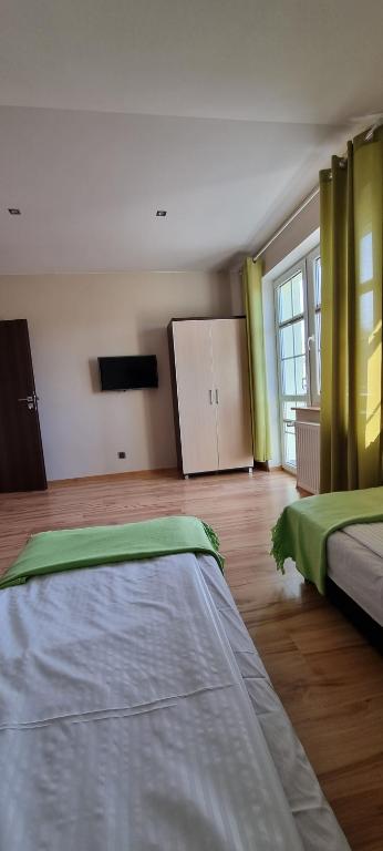 Postel nebo postele na pokoji v ubytování Pokoje w Zielonym Domku
