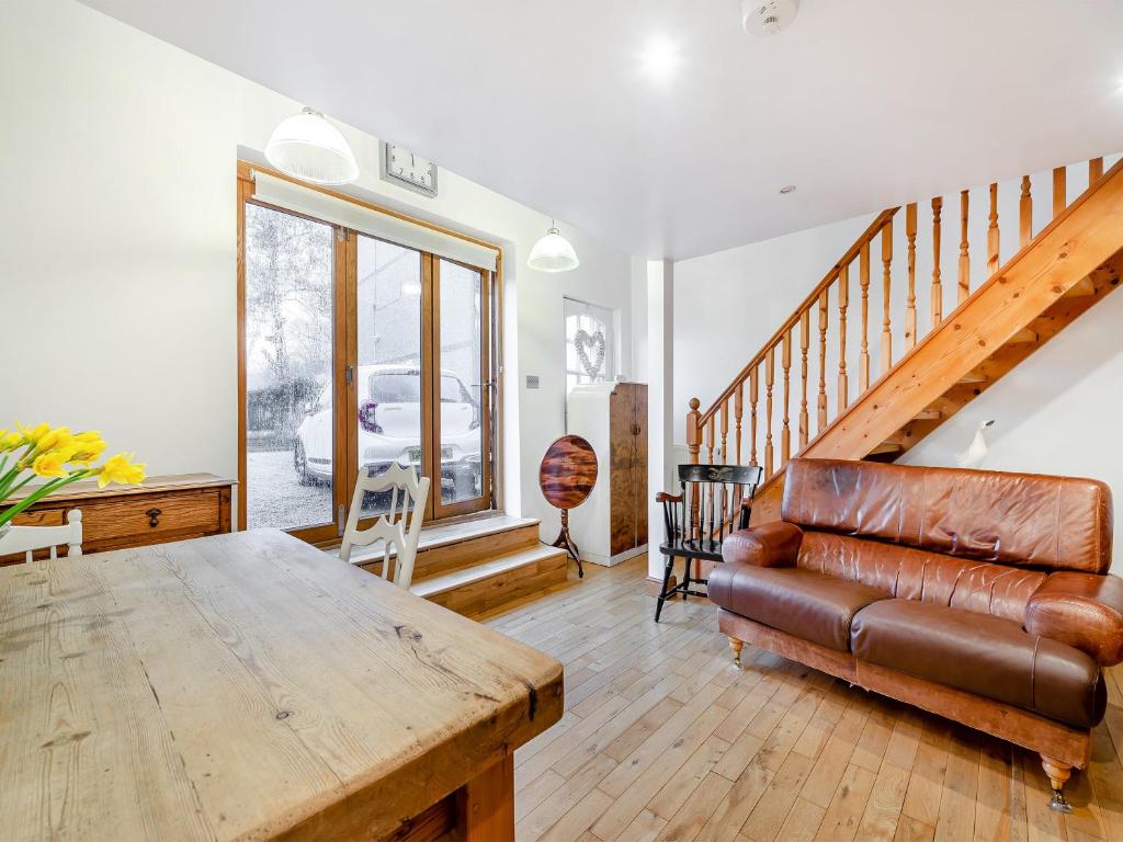 a living room with a couch and a table at Little Batley House in Westgate-on-Sea