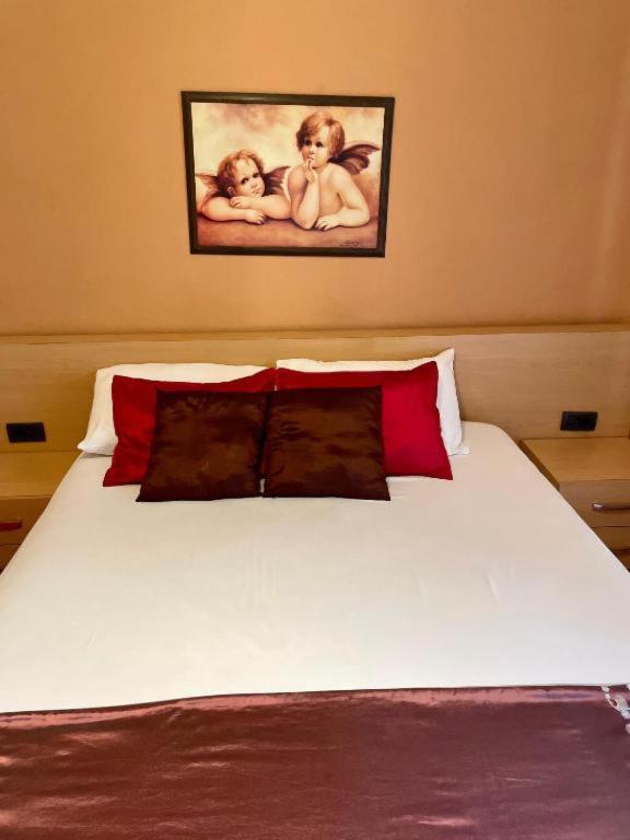 Ένα ή περισσότερα κρεβάτια σε δωμάτιο στο Hotel Algo