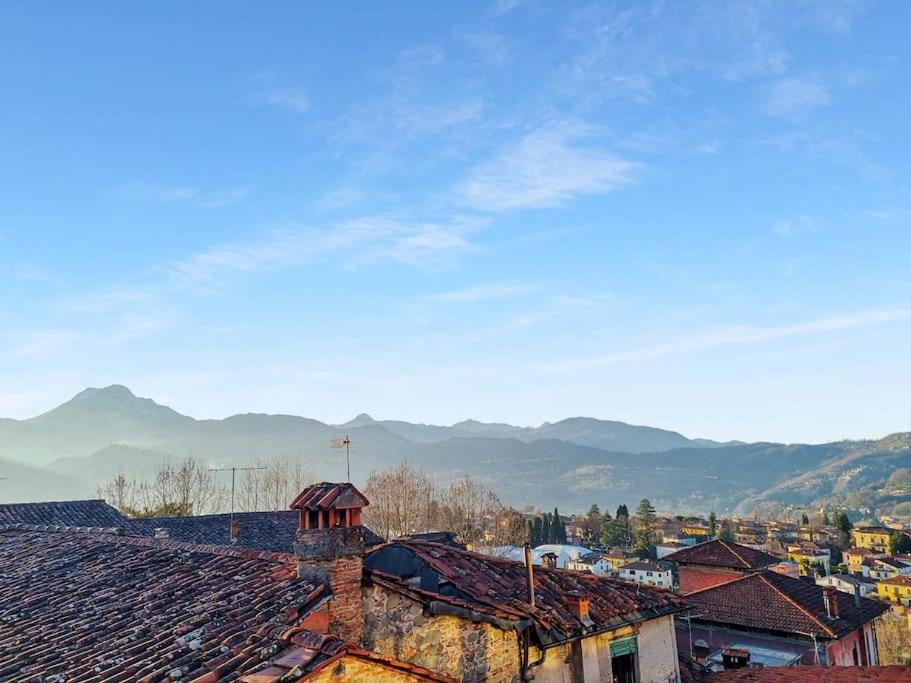 a view of a city with mountains in the background at * Apartment in Barga Old Town with amazing views in Barga