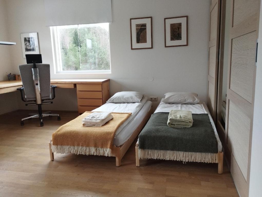Postel nebo postele na pokoji v ubytování Susimetsa
