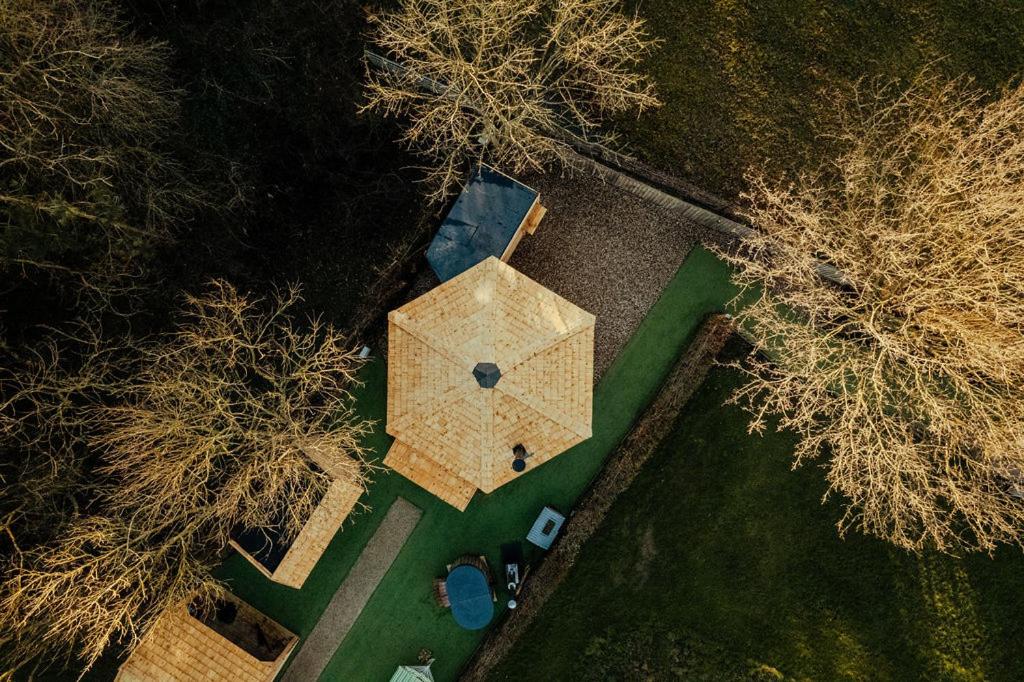 an overhead view of a house with trees at Hex at Hollands Farmhouse in Dorchester