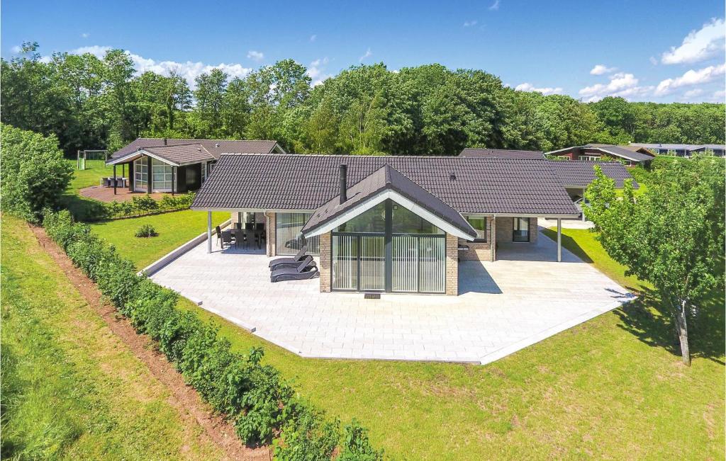 an overhead view of a house with a large patio at Three-Bedroom Holiday Home In Sydals in Sarup