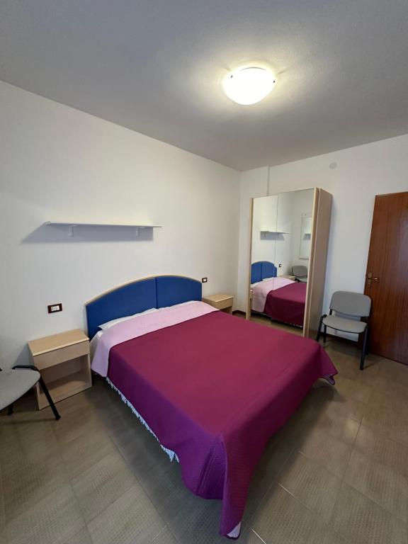 A bed or beds in a room at Residence Beatrice - Agenzia Cocal