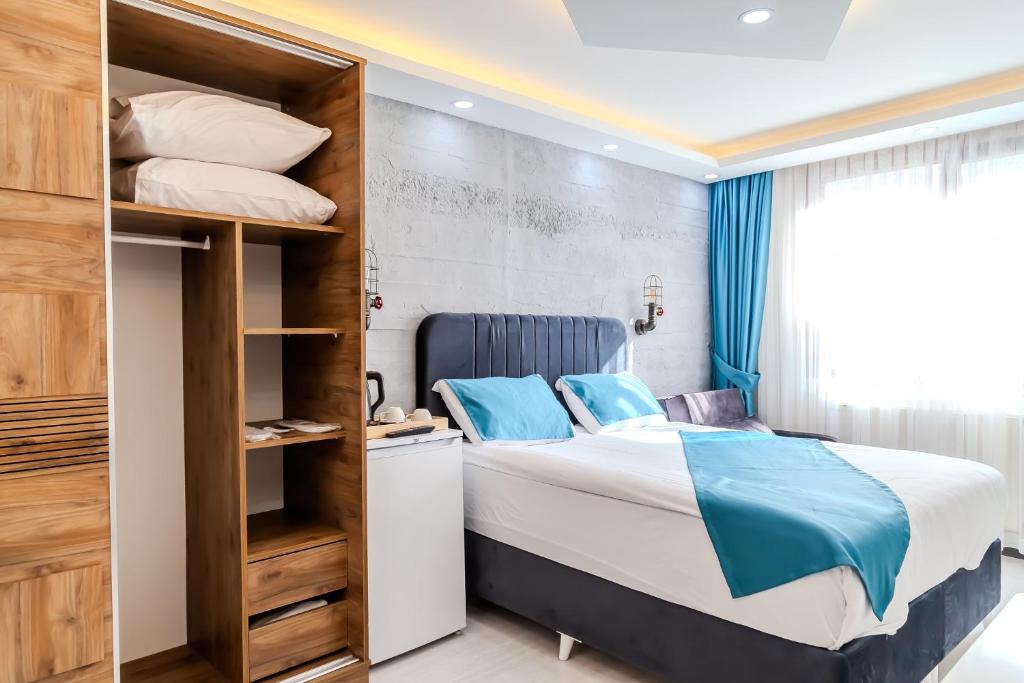 Postel nebo postele na pokoji v ubytování Palladium APART Hotel