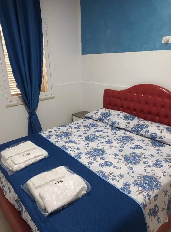 A bed or beds in a room at Trenta metri dal mare Caraibico