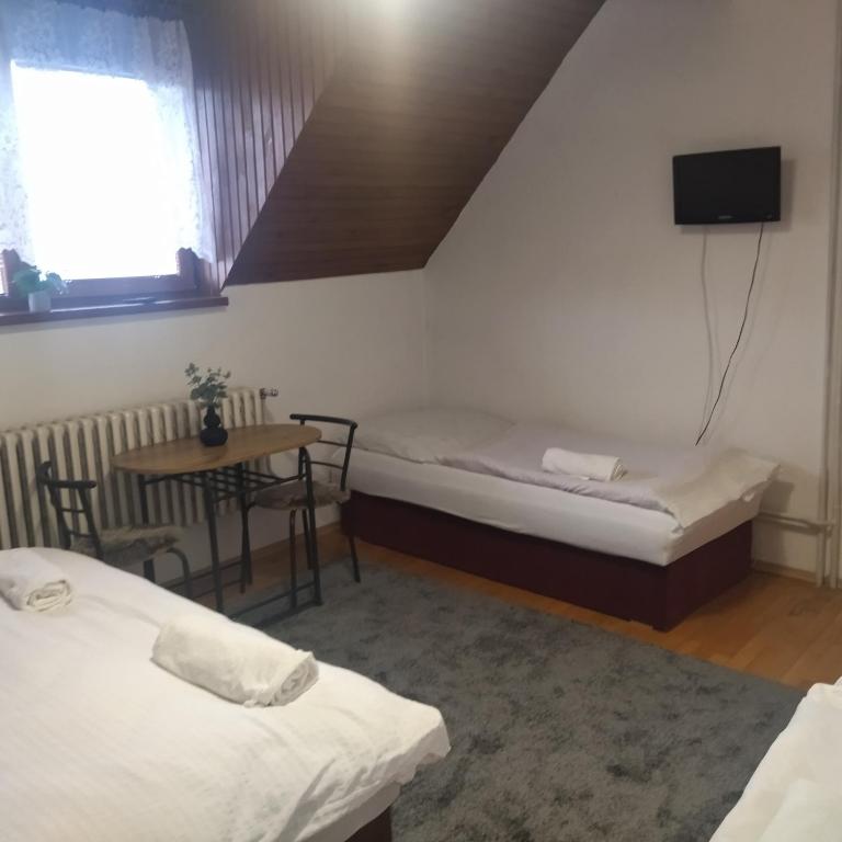 Posteľ alebo postele v izbe v ubytovaní Penzion Helena