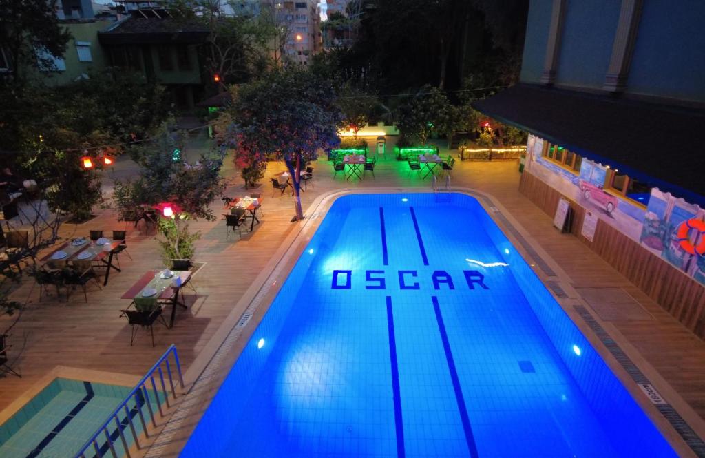 an overhead view of a swimming pool at night at oscar garden hotel in Antalya