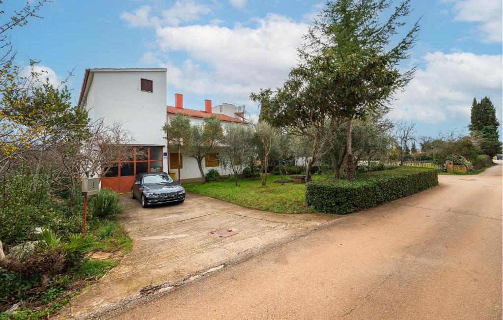 a car parked in front of a house at 2 Bedroom Cozy Apartment In Fazana in Fažana