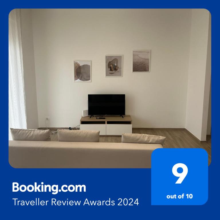 a living room with a couch and a tv at A Ca' di Giulietto in Albenga