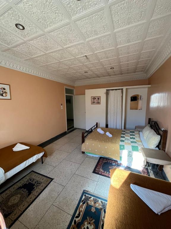Postel nebo postele na pokoji v ubytování Diyar Timnay