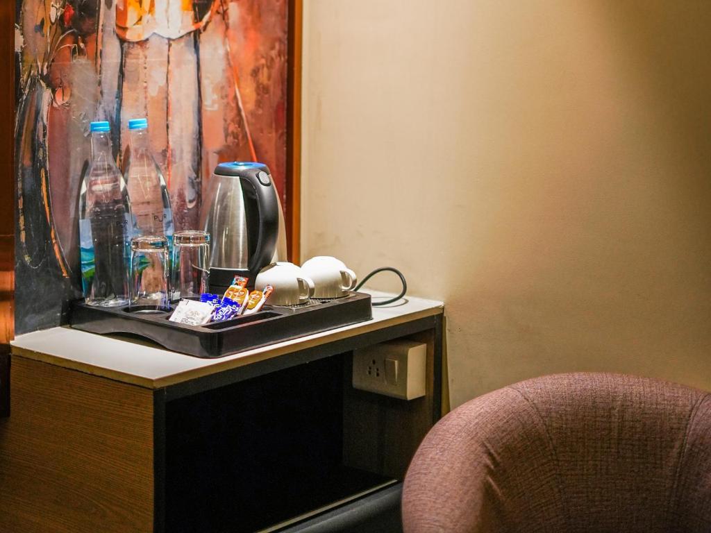 Příslušenství pro přípravu čaje a kávy v ubytování Hotel Levelup Signature