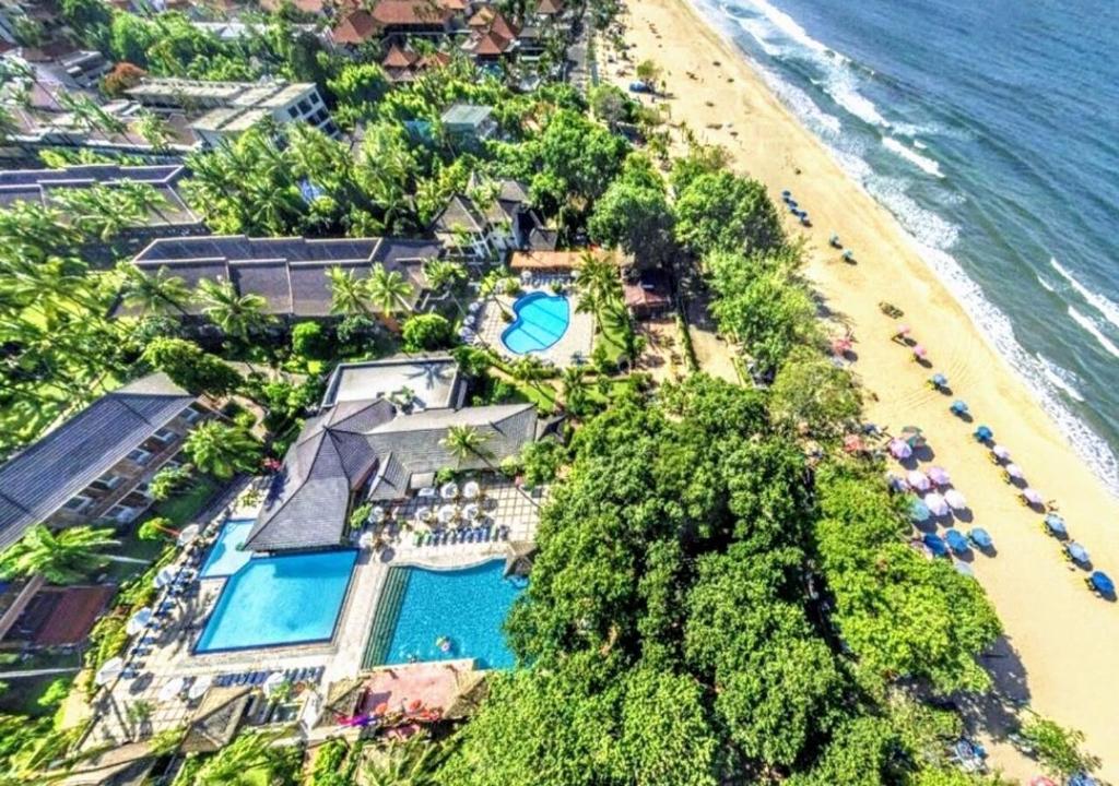 an aerial view of a resort and the beach at Suite Hotel Apartment Legian by RCP in Seminyak