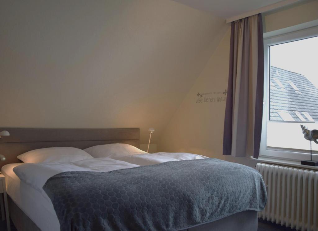 Postel nebo postele na pokoji v ubytování Haus Triton
