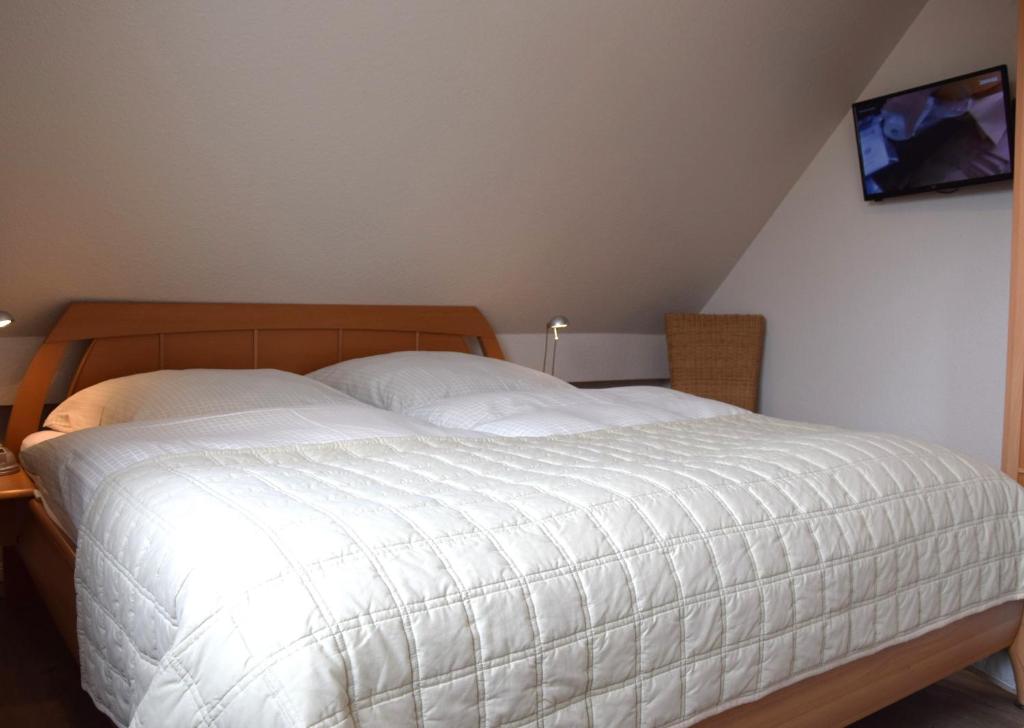 Postel nebo postele na pokoji v ubytování Haus Triton