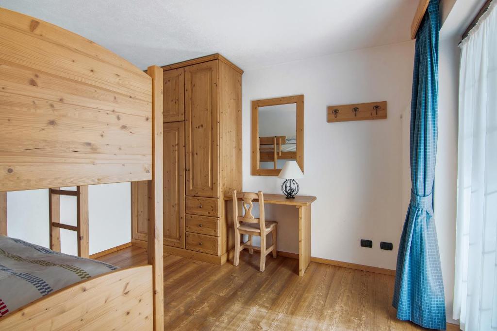 Postel nebo postele na pokoji v ubytování Residence Larice Bianco App n5