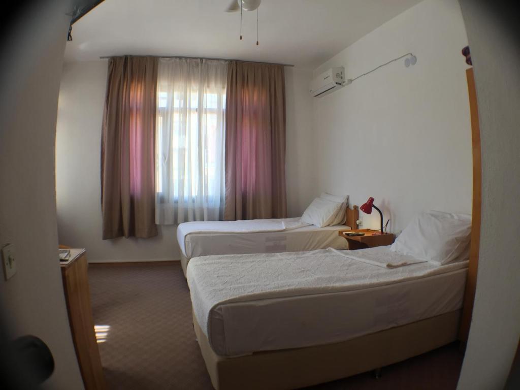 מיטה או מיטות בחדר ב-Hotel Efes