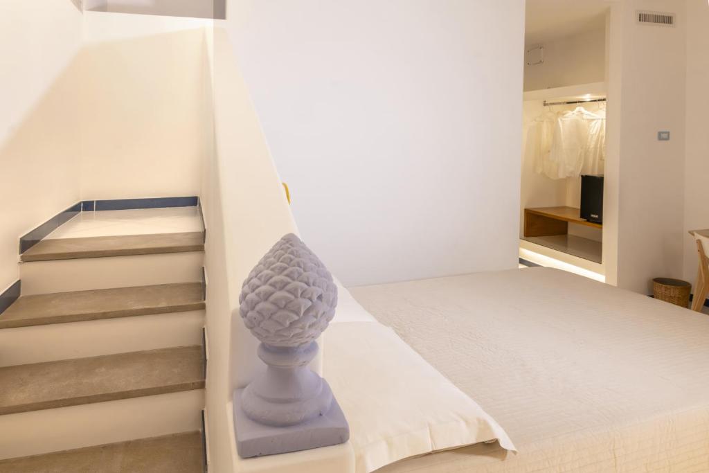 Postel nebo postele na pokoji v ubytování Gheba Suites