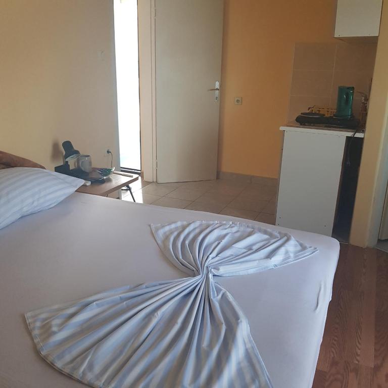 Postel nebo postele na pokoji v ubytování Apartments Nenadić