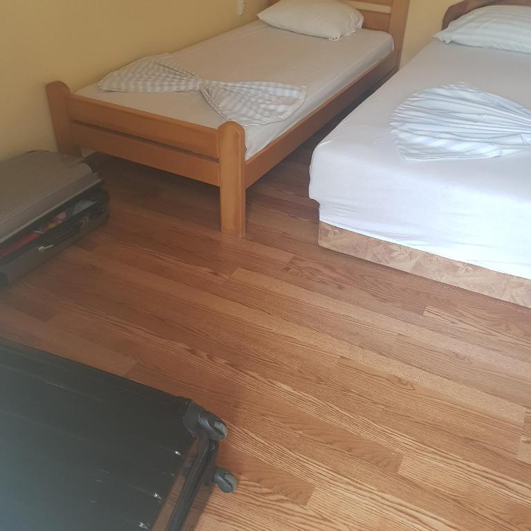 Postel nebo postele na pokoji v ubytování Apartments Nenadić