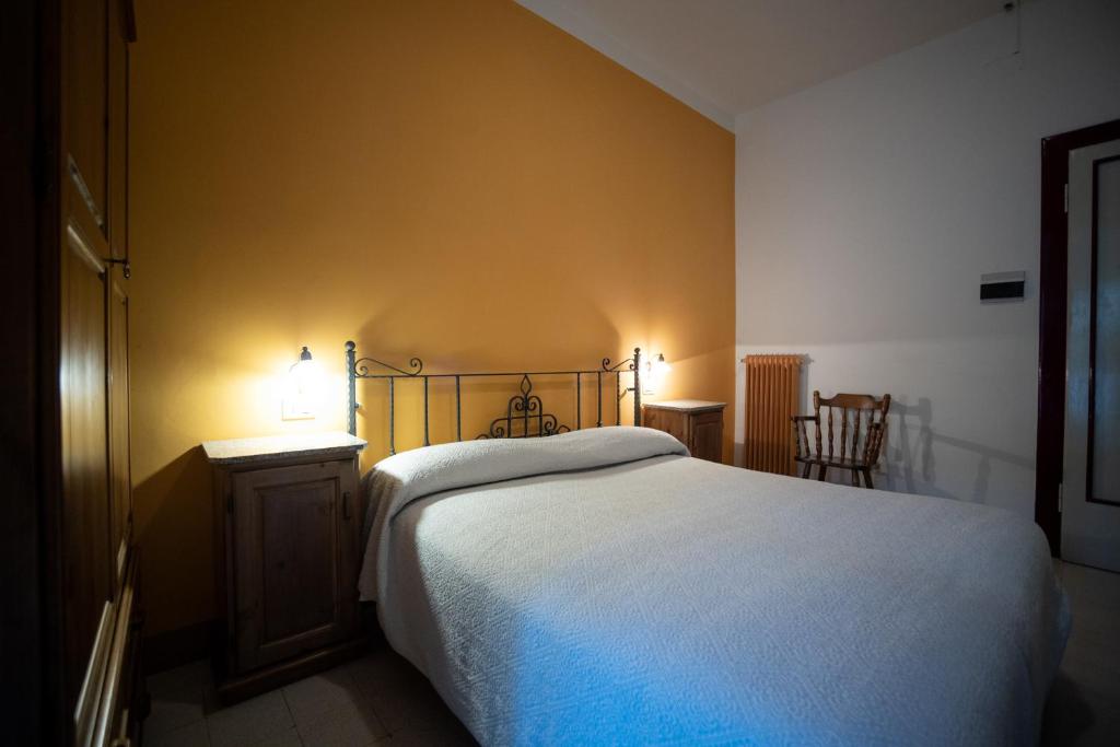 Postel nebo postele na pokoji v ubytování Hotel Leon D'Oro