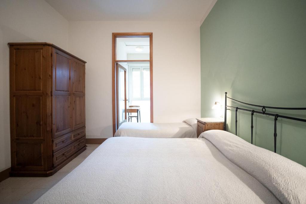 Postel nebo postele na pokoji v ubytování Hotel Leon D'Oro