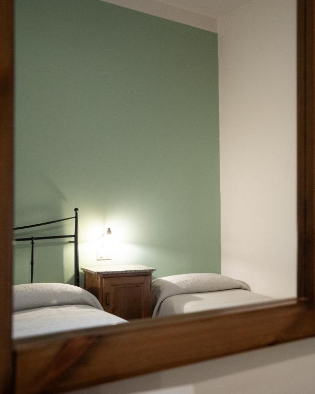 Postel nebo postele na pokoji v ubytování Hotel Leon D'Oro